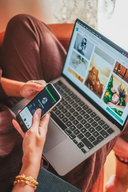 Two people using a laptop for online shopping, highlighting modern e-commerce trends.